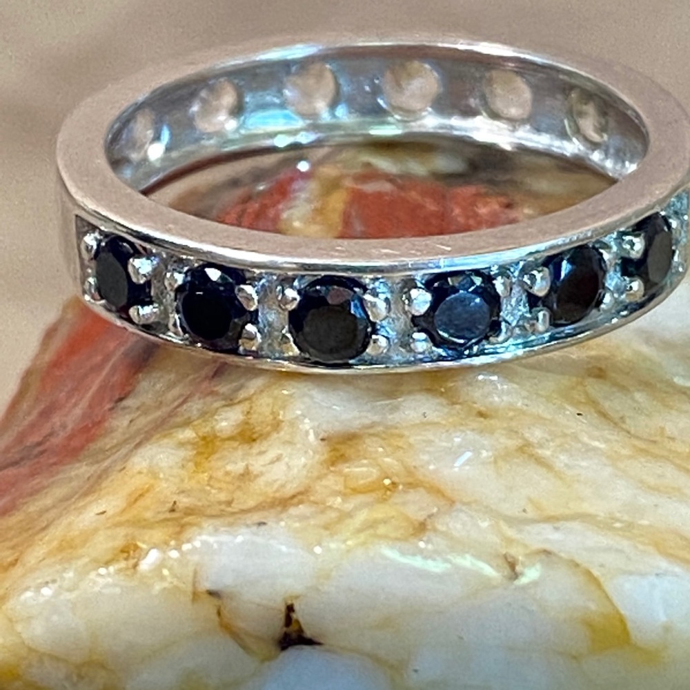 Black spinel and white topaz ring